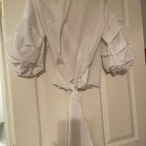 Long sleeve, V-neck, Ruffle accents, White.